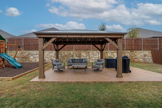 view of patio / terrace with a playground, outdoor lounge area, and a gazebo