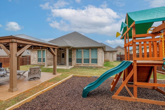 view of playground featuring a gazebo and a patio area