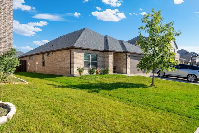 view of home's exterior featuring a garage and a yard