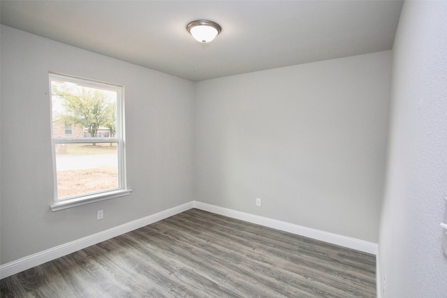 empty room featuring dark wood-type flooring