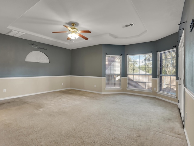 carpeted empty room featuring ceiling fan