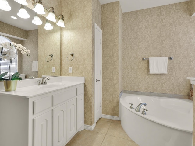 bathroom featuring vanity, tile patterned flooring, and a bathing tub