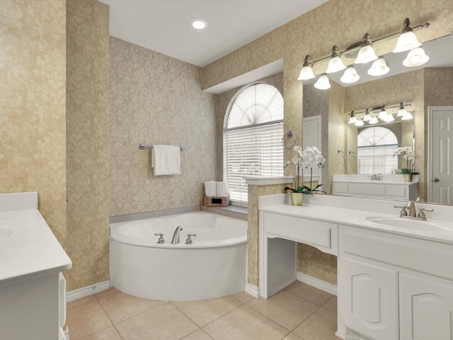 bathroom featuring a tub to relax in, tile patterned floors, and a healthy amount of sunlight