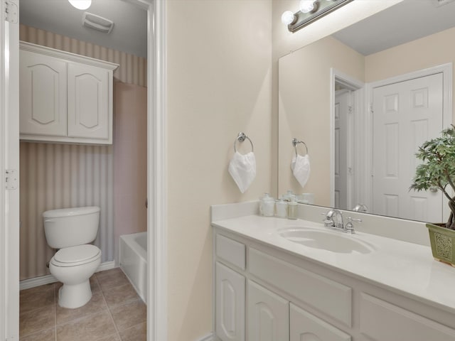 full bathroom with toilet, bathtub / shower combination, vanity, and tile patterned floors