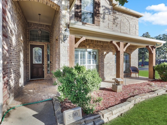 property entrance with covered porch