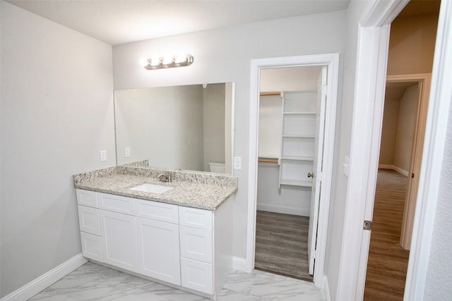 bathroom featuring vanity and hardwood / wood-style floors