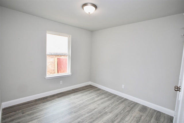 unfurnished room featuring hardwood / wood-style flooring