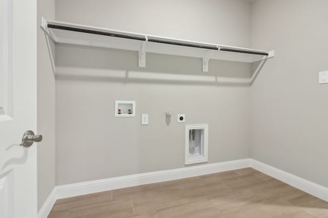 laundry room featuring hookup for a gas dryer, hookup for an electric dryer, hookup for a washing machine, and hardwood / wood-style flooring