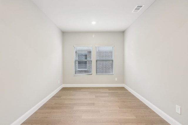 spare room featuring light wood-type flooring