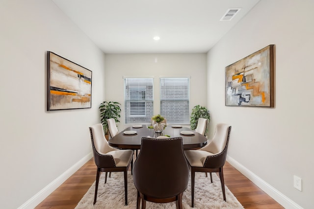 dining room with hardwood / wood-style flooring