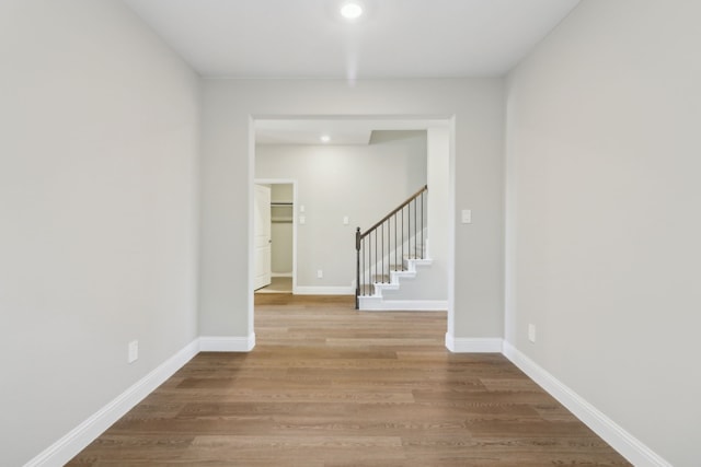 hall with wood-type flooring