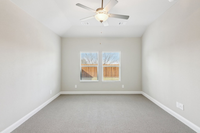 spare room featuring carpet floors and ceiling fan