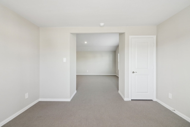 unfurnished room featuring carpet flooring