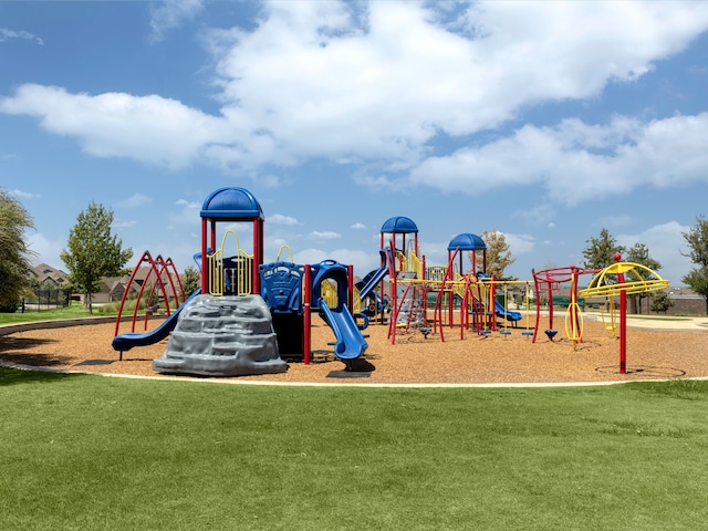 view of jungle gym with a lawn