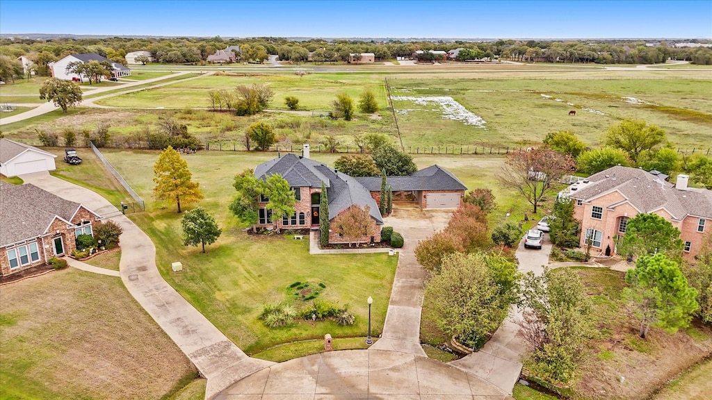 birds eye view of property featuring a rural view