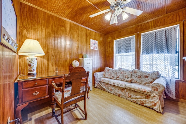 office area with wooden ceiling, plenty of natural light, wooden walls, and light wood-type flooring