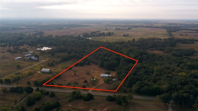 1345 Fm 1563, Wolfe City, TX 75496 - aerial view of sparsely populated area with property boundaries highlighted and a heavily wooded area