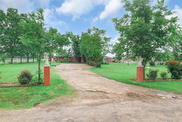 view of property's community featuring a yard