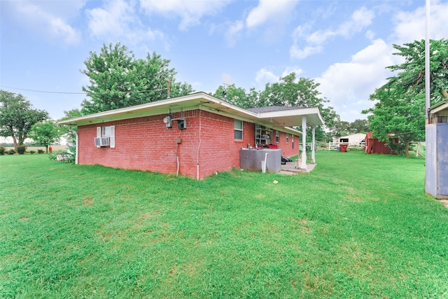 view of home's exterior featuring a lawn and cooling unit