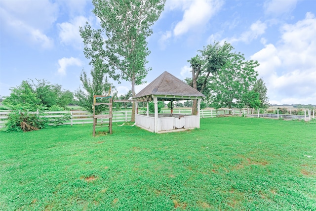 view of yard featuring a gazebo and a rural view