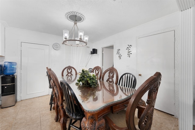 dining space featuring a textured ceiling, a notable chandelier, and light tile patterned flooring