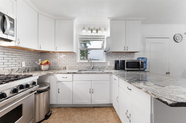 kitchen featuring white cabinetry, sink, and stainless steel appliances