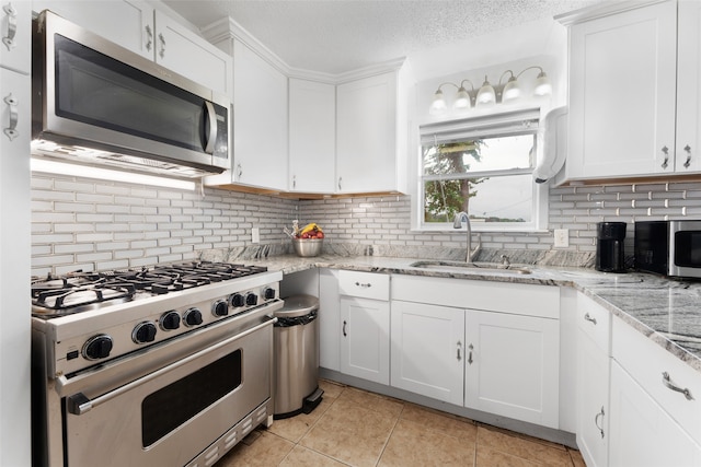 kitchen featuring white cabinetry, sink, and stainless steel appliances