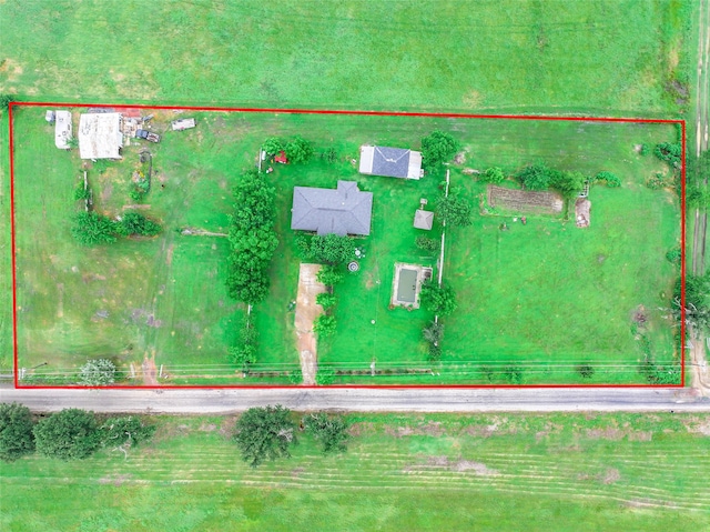 birds eye view of property with a rural view