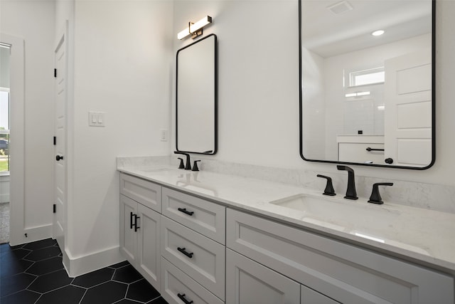 bathroom featuring vanity and tile patterned flooring