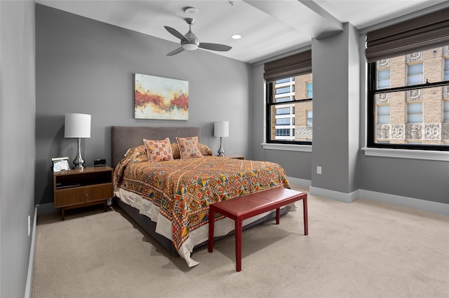 bedroom with light colored carpet and ceiling fan