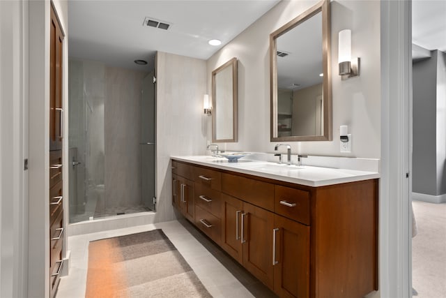 bathroom with walk in shower and vanity