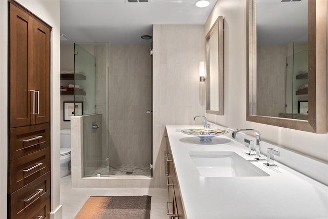 bathroom with walk in shower, tile patterned flooring, vanity, and toilet