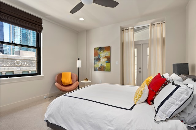 bedroom with ceiling fan and carpet flooring