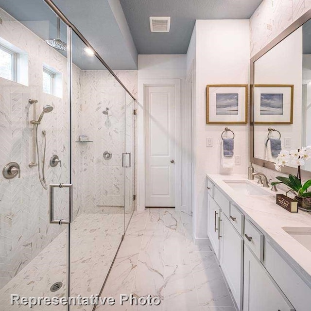 bathroom with an enclosed shower and vanity