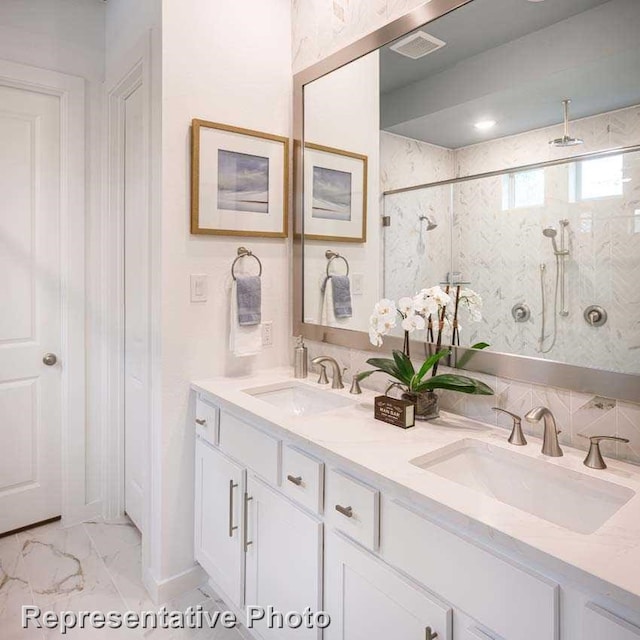 bathroom featuring vanity and a tile shower