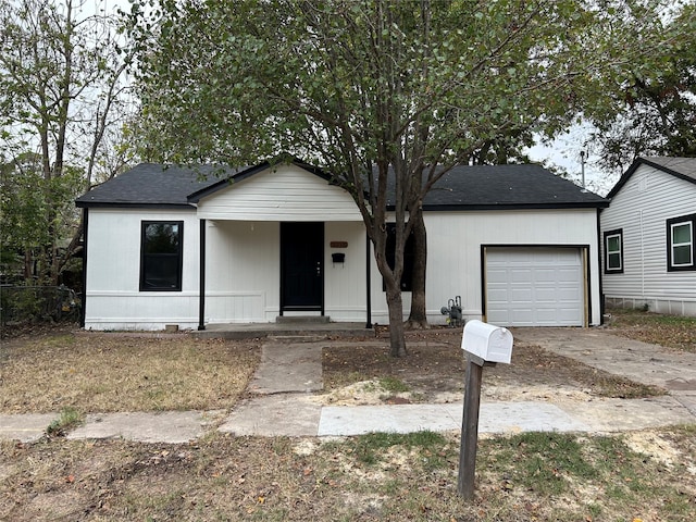 view of front of home featuring covered porch and a garage