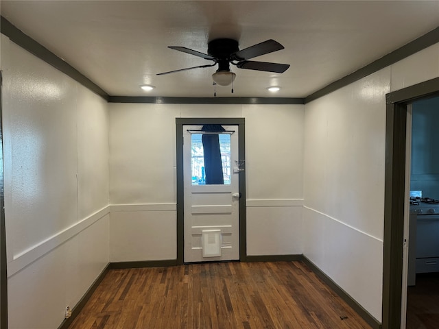 entrance foyer with ceiling fan, dark hardwood / wood-style flooring, and crown molding