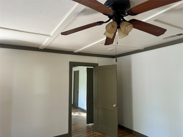 empty room featuring ceiling fan and dark hardwood / wood-style flooring