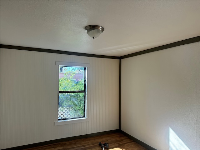 empty room with dark hardwood / wood-style floors