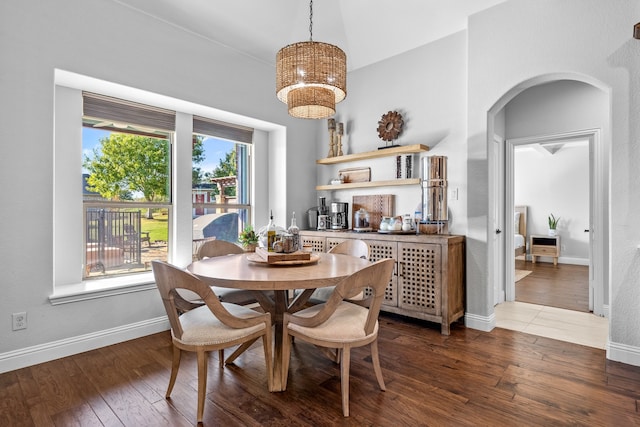 dining space featuring dark wood-type flooring