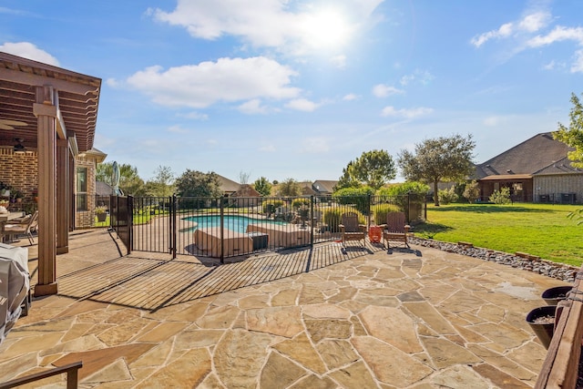 view of swimming pool featuring a lawn and a patio