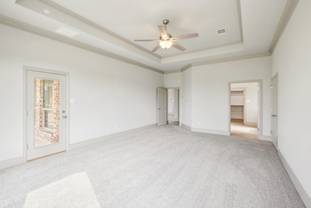 unfurnished bedroom featuring access to exterior, ceiling fan, a spacious closet, crown molding, and light carpet