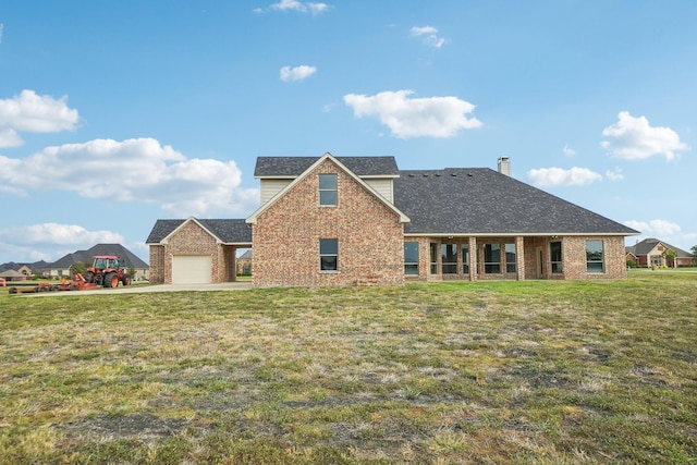 front of property featuring a garage and a front lawn