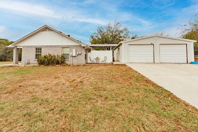 ranch-style home featuring a garage and a front yard