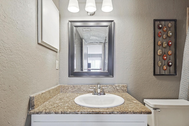 full bathroom with shower / tub combo with curtain, vanity, toilet, and tile patterned flooring