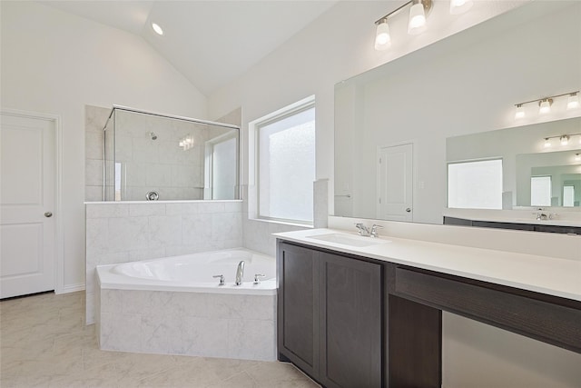 bathroom with tile patterned floors, plus walk in shower, vanity, and vaulted ceiling