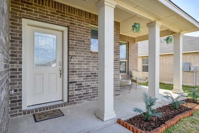 property entrance featuring a porch