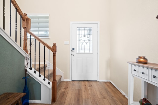 2816 Brosnan Rd, Waco, TX 76655 - foyer entrance featuring light wood-style floors, baseboards, and stairway