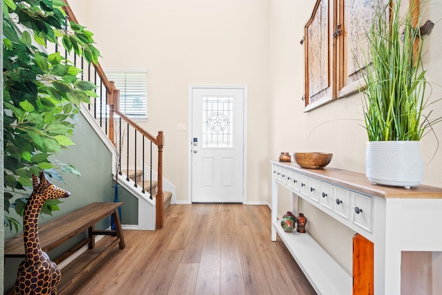 2816 Brosnan Rd, Waco, TX 76655 - foyer featuring light wood finished floors, stairway, baseboards, and a high ceiling
