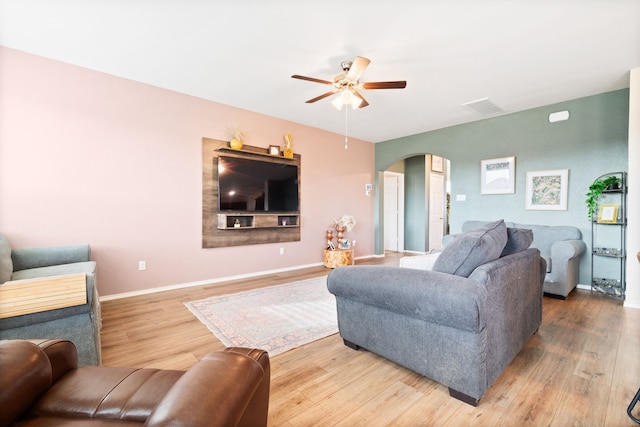 living room with hardwood / wood-style floors and ceiling fan